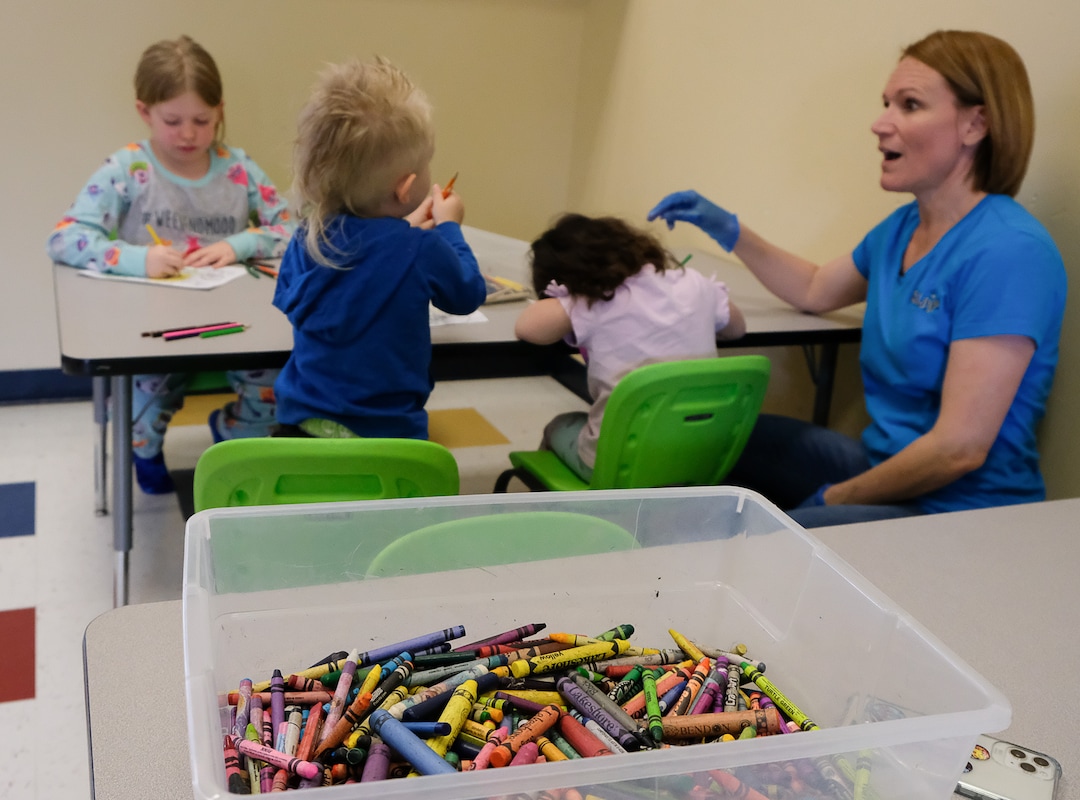 (Francisco Kjolseth  |  The Salt Lake Tribune) Monica Miles, director of The Buddy Bin child care business in North Salt Lake, has seen a dramatic drop in the number of kids coming to the center but is also trying to help families who are first responders and essential workers. Taking many precautions during the coronavirus pandemic, she and her son Brandon, who is the co-director, have fun with the kids with a number of activities on Thursday, March 26, 2020.