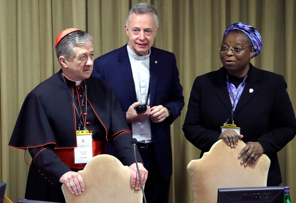 (AP Photo/Alessandra Tarantino, Pool) Sister Veronica Openibo, right, stands next to Chicago Archbishop Cardinal Blase J. Cupich, left, and Father Tomaz Mavric, center, as they wait for Pope Francis to arrive at the third day of a Vatican's conference on dealing with sex abuse by priests, at the Vatican, Saturday, Feb. 23, 2019. The prominent Nigerian nun has blasted the culture of silence in the Catholic Church that has long sought to hide clergy sexual abuse, telling a Vatican summit that transparency and an admission of mistakes is needed to restore trust.