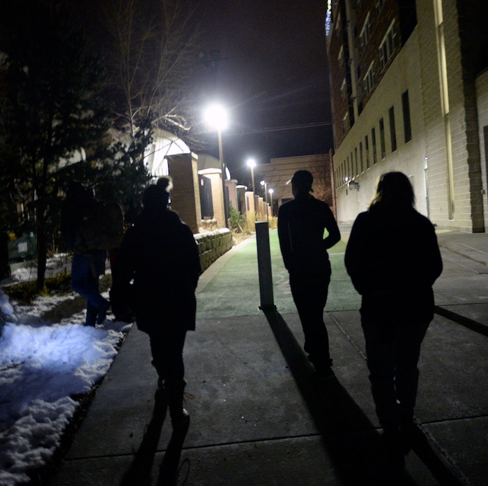 (Al Hartmann | The Salt Lake Tribune) Volunteers walk through a neighborhood near Hidden Hollow in Sugar House at 4:20 a.m Thursday, Jan. 25, 2018, looking for homeless campers as part of the annual Point In Time survey.