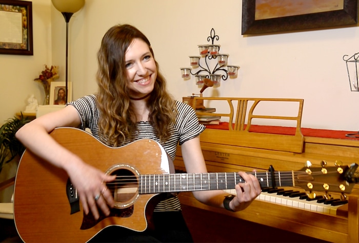 (Rick Egan  |  The Salt Lake Tribune) April Meservy plays the guitar at her home in Provo on Wednesday, Febr. 7, 2018. Meservy recorded a cover of U2’s “With or Without You,”  which will be used by Canadian pairs figure skaters Eric Radford and Meagan Duhamel  as they perform at this year’s Winter Olympic Games in PyeongChang, South Korea.