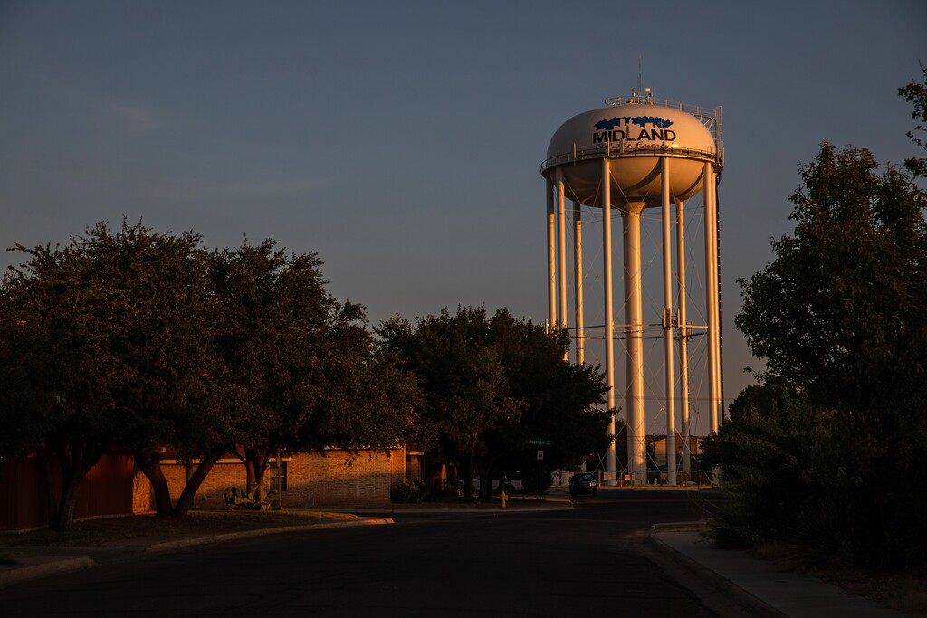 (Tamir Kalifa | The New York Times) 
A water tower stands in a Midland, Tex., neighborhood on Aug. 7, 2019.