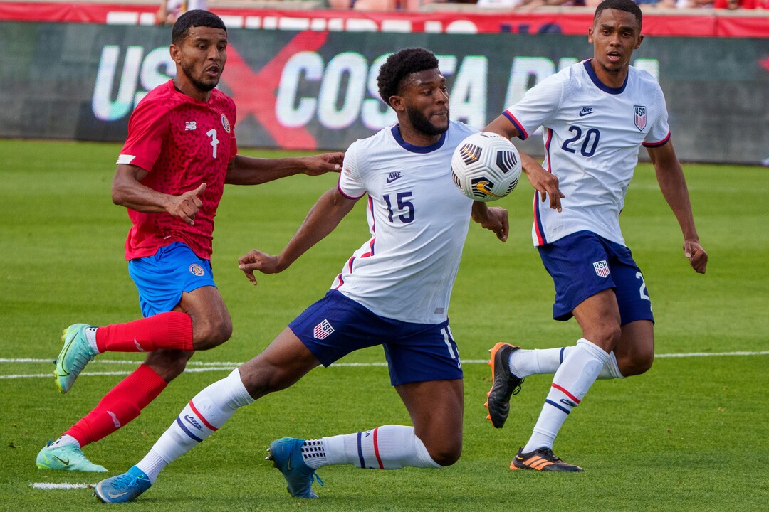 (Trent Nelson  |  The Salt Lake Tribune) United States defender Mark McKenzie blocks the ball away from the goal as the U.S. Men’s National Team (USMNT) faces Costa Rica in a friendly at Rio Tinto Stadium in Sandy on Wednesday, June 9, 2021. At rear are Costa Rica forward Johan Venegas and United States defender Reggie Cannon.