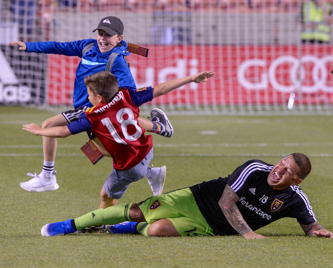 (Leah Hogsten  |  The Salt Lake Tribune) Real Salt Lake goalkeeper Nick Rimando (18) takes his son Jett out with a slide tackle after the win. Real Salt Lake defeated Philadelphia Union 4-0 in MLS Soccer at Rio Tinto Stadium in Sandy, Utah on Sat, July 13, 2019.