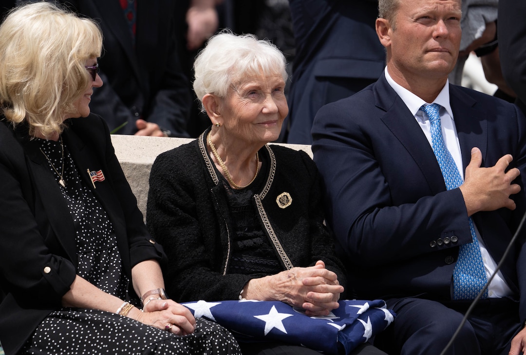 (Francisco Kjolseth | The Salt Lake Tribune) Elaine Hatch, center, window of former U.S. Sen. Orrin Hatch is joined by her daughter Marcia Hatch Whetton and her son Jess Hatch as Gov. Spencer Cox addresses her after being presented the flag covering her husband’s casket, following funeral services The Church of Jesus Christ of Latter-day Saints Institute of Religion in Salt Lake City on Friday, May 6, 2022. Hatch, the longest-serving Republican senator in U.S. history and the longest-serving from Utah, died April 23 at age 88.