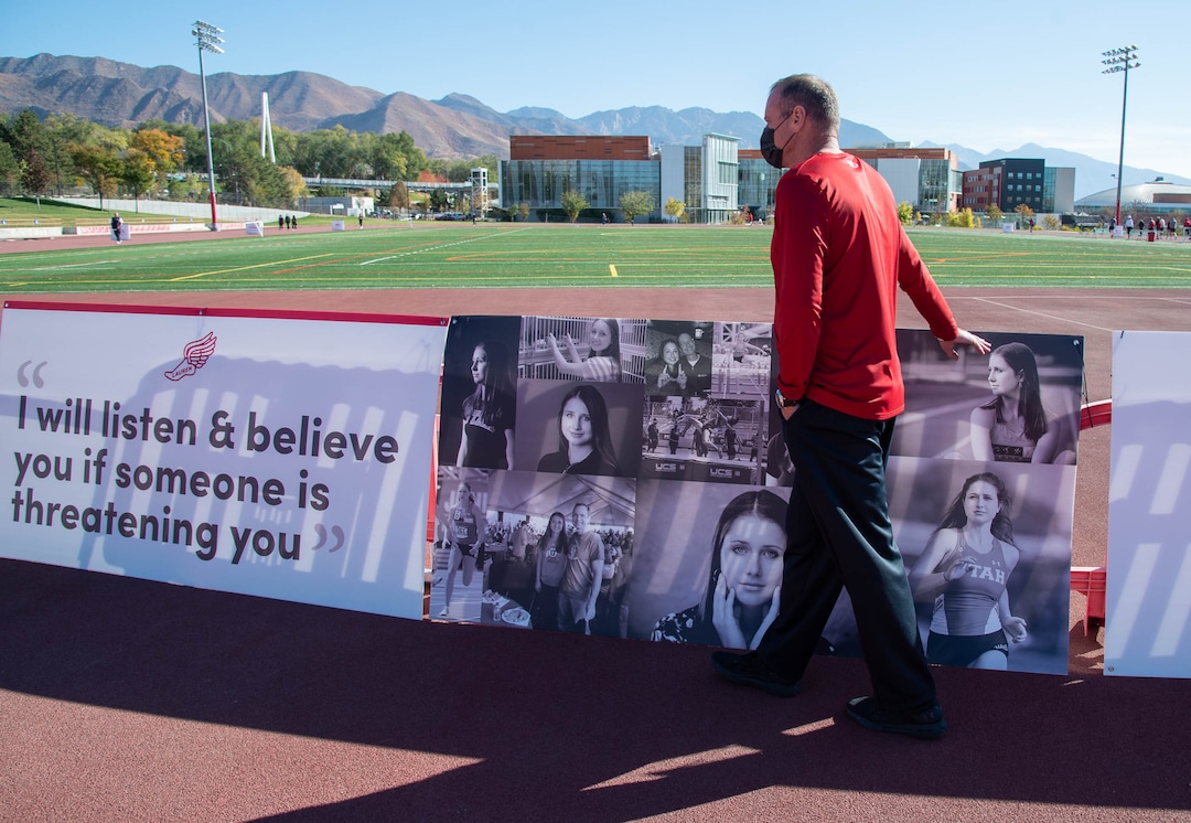 (Francisco Kjolseth  |  The Salt Lake Tribune) University of Utah basketball coach Larry Krystkowiak, acknowledges a banner honoring student and track athlete Lauren McCluskey, after standing in silence on Thursday, Oct. 22, 2020, on the two-year anniversary of her murder.