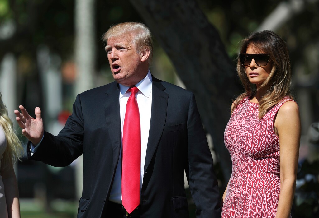 (Pablo Martinez Monsivais | The Associated Press) President Donald Trump stops to speak to members of the media as he arrives for Easter services with his wife, Melania Trump, at Episcopal Church of Bethesda-by-the-Sea in Palm Beach, Fla., Sunday, April 1, 2018.