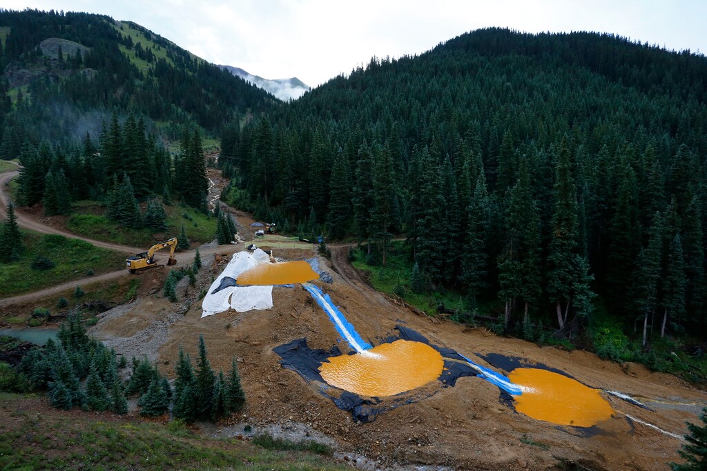 (Brennan Linsley | Associated Press file photo) In this Aug. 12, 2015, file photo, water flows through a series of retention ponds built to contain and filter out heavy metals and chemicals from the Gold King Mine spill near Silverton, Colo. The U.S. Environmental Protection Agency has found a place to store sludge from a treatment plant cleaning up the mine's wastewater.