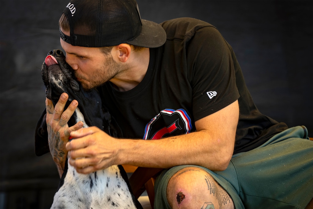 (Rick Egan | The Salt Lake Tribune) Jacob Schmitt with his dog Buddy, at his home in Ogden, on Thursday, July 31, 2025.