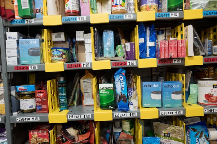 In this Wednesday, Dec. 20, 2017, photo, a variety of items are stocked on shelves at the Amazon Prime warehouse in New York. (AP Photo/Mark Lennihan)