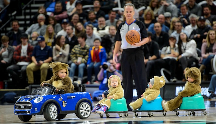 (Steve Griffin  |  The Salt Lake Tribune) Children dressed up as bears ride around the court in a car being driven remotely by the Jazz Bear during a time out in the Utah Jazz versus Denver Nuggets NBA basketball game at Vivint Smart Home Arena  in Salt Lake City Tuesday November 28, 2017.