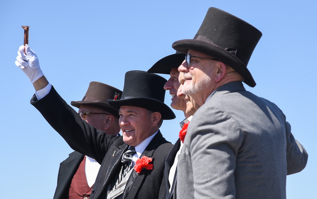 (Francisco Kjolseth  |  The Salt Lake Tribune)  Governor Gary Herbert holds up a copper spike on Friday May 10, 2019, in celebration of the 150th anniversary of the completion of the transcontinental railroad at Promontory Summit where the two rails met back on May 10, 1869.