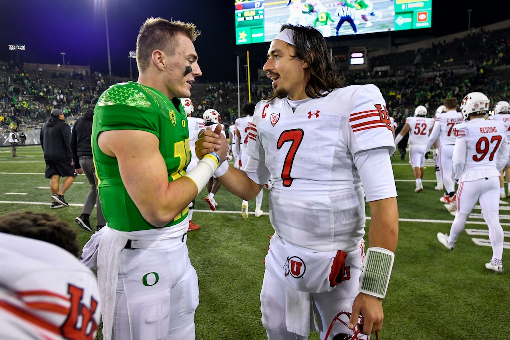 (Andy Nelson | AP) Oregon quarterback Bo Nix (10) and Utah quarterback Cameron Rising (7) shake hands after an NCAA college football game Saturday, Nov. 19, 2022, in Eugene, Ore. Oregon beat Utah 20-17.