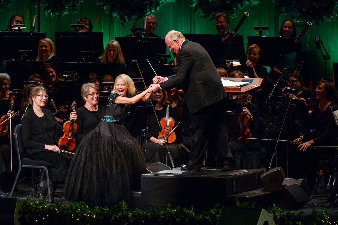 Leah Hogsten  |  The Salt Lake Tribune  Kristin Chenoweth teases conductor Mack Wilberg during the performance with The Tabernacle Choir during the first of three sold-out Christmas concert performances Thursday, December 13, 2018 at the The Church of Jesus Christ of Latter-day Saints Conference Center in Salt Lake City.