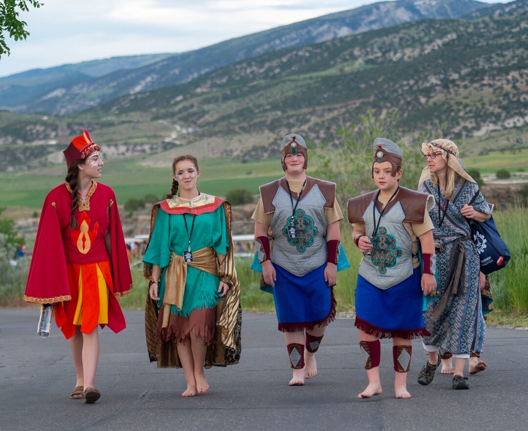 (Rick Egan  |  The Salt Lake Tribune)    Nephites, Lamanites and Pioneers walk down the hill to greet the crowd before the Mormon Miracle Pageant, Wednesday, June 12, 2019.  The final run for the pageant continues through Saturday, June 22.