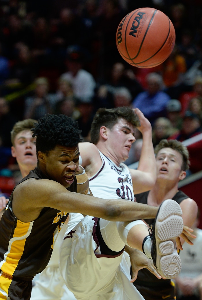 (Francisco Kjolseth  |  The Salt Lake Tribune)  Davis vs Lone Peak, 6A State high school basketball tournament at the Huntsman Center in Salt Lake City, Thursday March 1, 2018. Brendon Redford (12) battles Jasckon Brinkerhoff (30). 