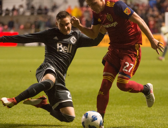 (Rick Egan  |  The Salt Lake Tribune)      Vancouver Whitecaps defender Jake Nerwinski (28) goes for the ball along with 
Real Salt Lake forward Corey Baird (27), in MLS action between Real Salt Lake and Vancouver Whitecaps, at Rio Tinto Stadium beSaturday, April 7, 2018.


