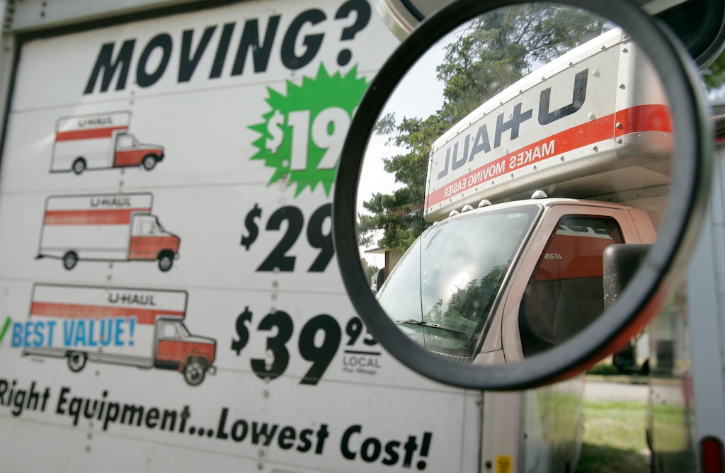 (Charlie Neibergal | AP file photo) In this June 14, 2006, file photo, a U-Haul truck is seen in the side mirror of a another truck sitting on a dealer lot in Des Moines, Iowa.