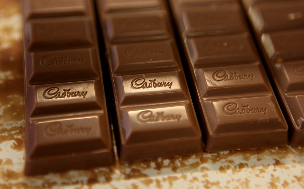 (Simon Dawson | The Associated Press) In this Nov. 20, 2009 file photo chocolate moves down the production line at the Cadburys factory in Birmingham, England. Water supply problems affected a Cadbury plant after freezing weather in England, but the company never stopped making candy. A false story made that claim after bitter weather followed by a thaw led to burst pipes in the Birmingham area. That’s where Cadbury’s flagship Bournville factory produces Dairy Milk chocolate bars, Easter creme eggs and other treats. Cadbury says there was a limited supply of water for a brief period, but sweets production never came to a halt.