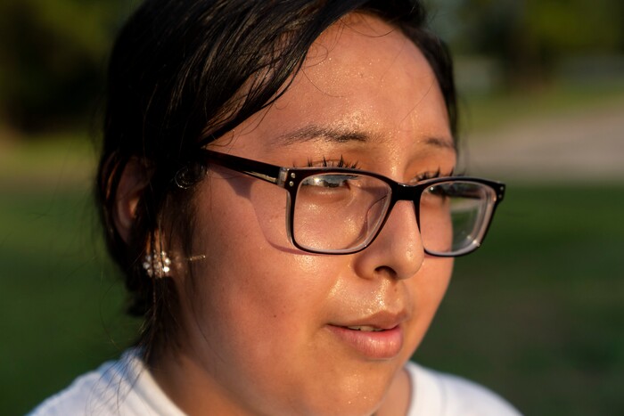 (Ilana Panich-Linsman | The New York Times) Norma Rodriguez, who works two jobs and is planning for community college, plays catch in a park as the evening cooled off in Houston, July 19, 2020. Around the world, the poor and marginalized are much more likely to be vulnerable to extreme heat; Houston, one of America's fastest-warming cities, could average 109 days a year with the heat index topping 100 degrees.