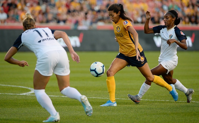 (Francisco Kjolseth  |  The Salt Lake Tribune)  Utah Royals FC forward Christen Press (23) tries to push past the defense as Utah Royals FC hosts the North Carolina Courage at Rio Tinto Stadium in Sandy, Utah on Saturday, July 27, 2019.