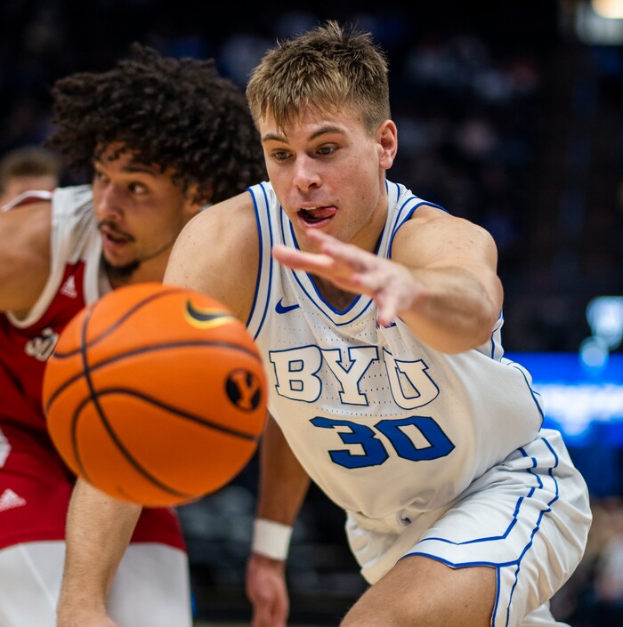 (Rick Egan | The Salt Lake Tribune)  Brigham Young Cougars guard Dallin Hall (30) goes for a loose ball, in basketball action between the Brigham Young Cougars and the South Dakota Coyotes, at Vivint Arena, in Salt Lake City, on Saturday, Dec. 3, 2022.
