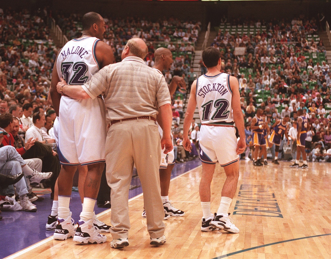 (Al Hartmann  |  Tribune file photo) Larry Miller walks the court with Karl Malone and John Stockton.