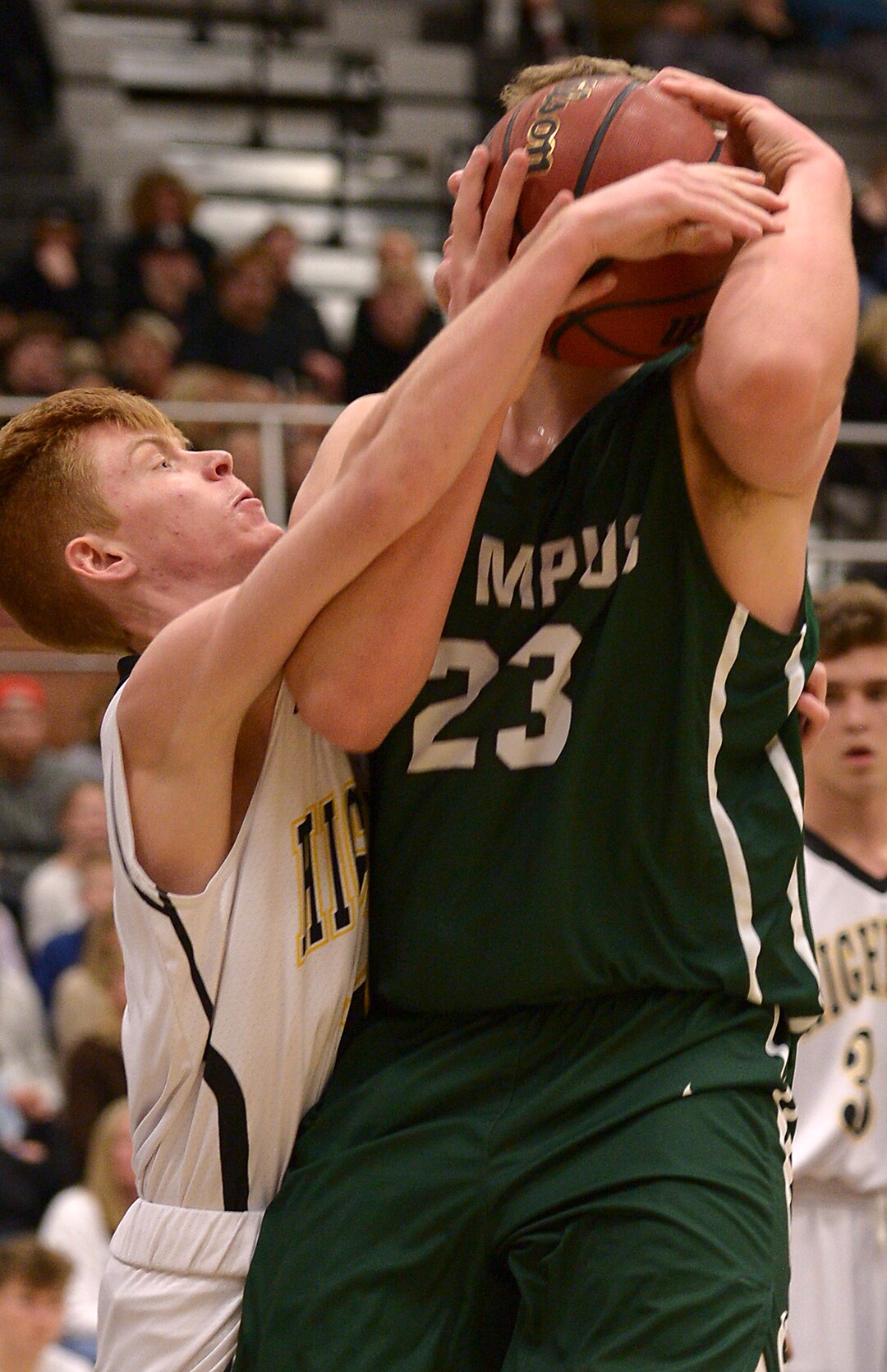 (Leah Hogsten  |  The Salt Lake Tribune) Highland's Sam Palmer smothers Olympus' Harrison Creer.  Olympus High School defeated Highland High School 86-54 during their basketball game, Tuesday, February 6, 2018.