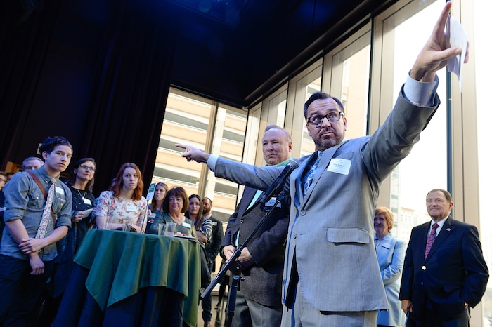 (Francisco Kjolseth  |  The Salt Lake Tribune)  Senator Jim Dabakis, D-Salt Lake, and House speaker Greg Hughes point out various legislators and political leaders who purchased tickets for students to attend Hamilton at the Eccles Theater on Thursday, April 19, 2018. As part of the New Nation Project, students wrote to legislators on topics important to them for a chance to win tickets to the popular production. 