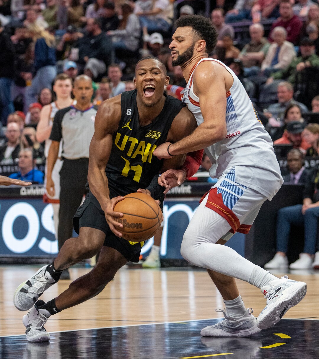 (Rick Egan | The Salt Lake Tribune) Utah Jazz guard Kris Dunn (11) tries to get past Denver Nuggets guard Jamal Murray (27), in NBA action between the Utah Jazz and the Denver Nuggets at Vivint Arena,  Saturday, April 8, 2023.