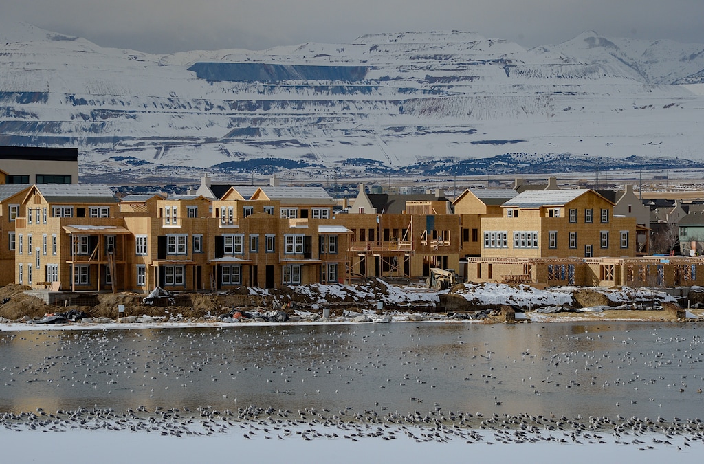 (Francisco Kjolseth  |  The Salt Lake Tribune) 

The Kennecott Copper Mine is seen in the background as ongoing development takes shape around Oquirrh Lake at Daybreak on Thursday, Jan. 9, 2020.