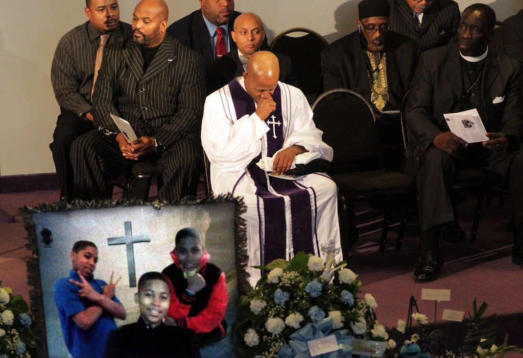 Pastor Henry Currie of Mary B. Wise Baptist Church collects himself during services for Tamir Rice, Wednesday, Dec. 3, 2014, in Willoughby, Ohio. Rice, 12, was shot and killed by a Cleveland police officer late last month. Police told The Plain Dealer the rookie officer who shot Rice believed the replica gun he waved was a real firearm. (AP Photo/The Plain Dealer, Lynn Ischay) MANDATORY CREDIT; NO SALES 