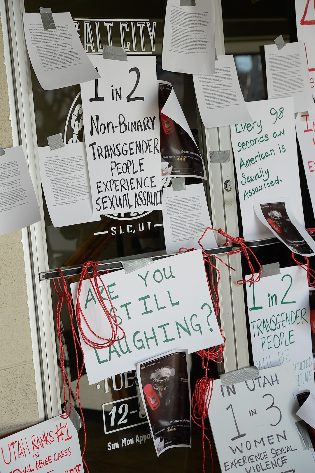 (Francisco Kjolseth  |  The Salt Lake Tribune)  Taking a stand against the normalization of rape and sexual violence, activists in Utah gather outside of Salt City Tattoo on Friday, Dec. 22, 2017, to protest following an Instagram post made by the shopÕs official Instagram account. The post in question was of a gift provided during the shop's white elephant exchange, a gift one of the artists at the parlor called a "rape kit," containing leather gloves, black duct tape, a bottle of lubricant, rope, and a knife.
