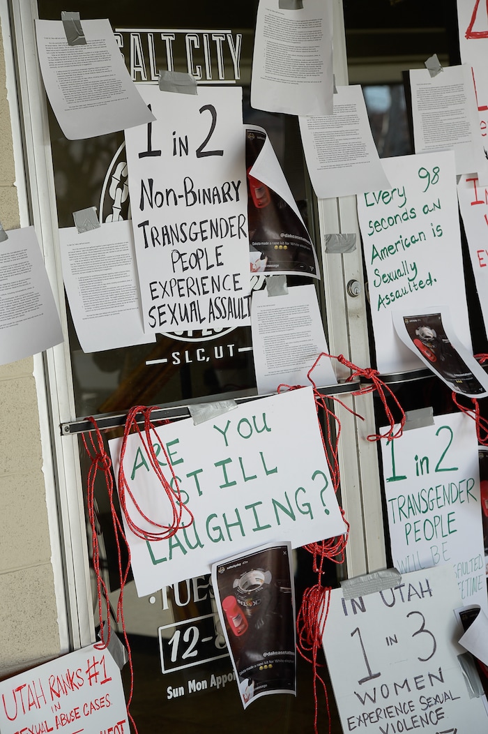 (Francisco Kjolseth | The Salt Lake Tribune) Taking a stand against the normalization of rape and sexual violence, activists in Utah gather outside of Salt City Tattoo on Friday, Dec. 22, 2017, to protest following an Instagram post made by the shopÕs official Instagram account. The post in question was of a gift provided during the shop's white elephant exchange, a gift one of the artists at the parlor called a "rape kit," containing leather gloves, black duct tape, a bottle of lubricant, rope, and a knife.