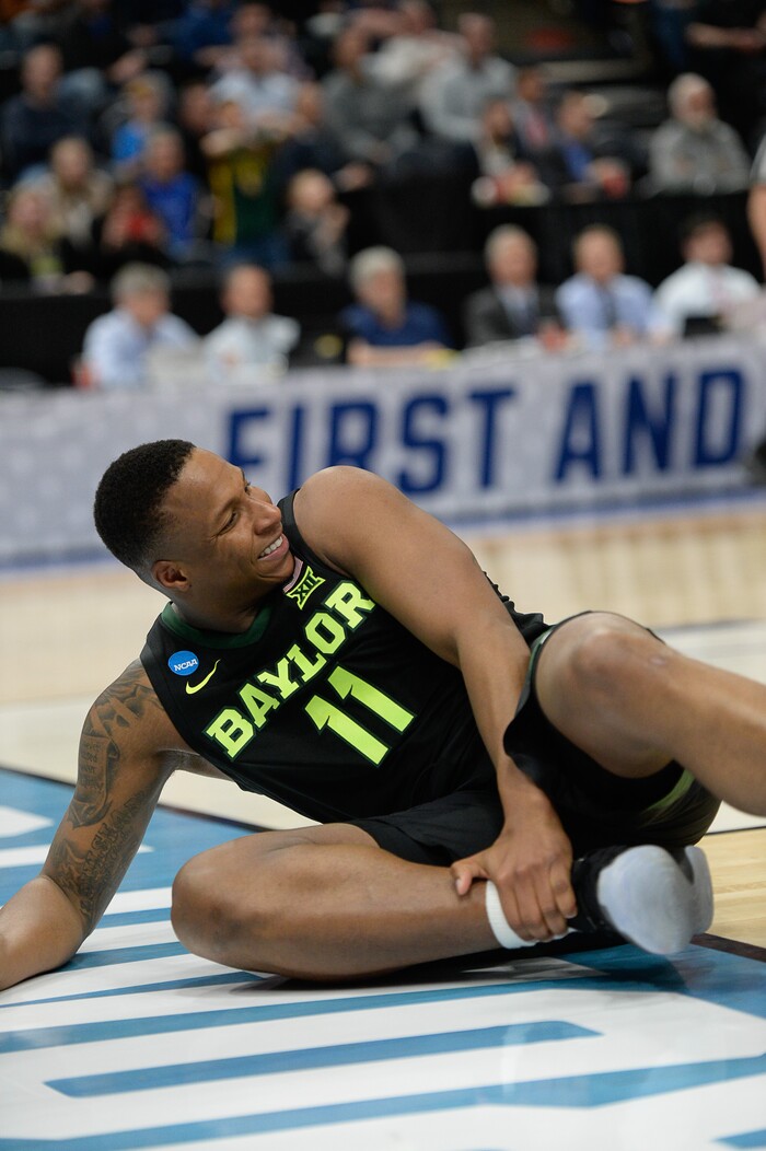 (Francisco Kjolseth  |  The Salt Lake Tribune)  Baylor Bears guard Mark Vital (11) momentarily hurts his ankle as Syracuse faces Baylor in their first round men's NCAA March Madness tournament game at Vivint Smart Home Arena in Salt Lake City on Thursday, March 21, 2019.