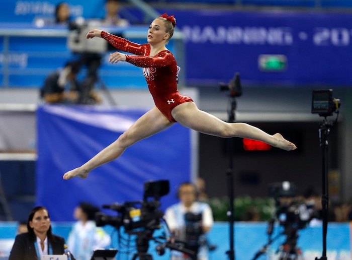 Mykayla Skinner of the United States performs her floor exercise routine during the women's team final of the Artistic Gymnastics World Championship at the Guangxi Gymnasium in Nanning, capital of southwest China's Guangxi Zhuang Autonomous Region Wednesday, Oct. 8, 2014. (AP Photo/Andy Wong)