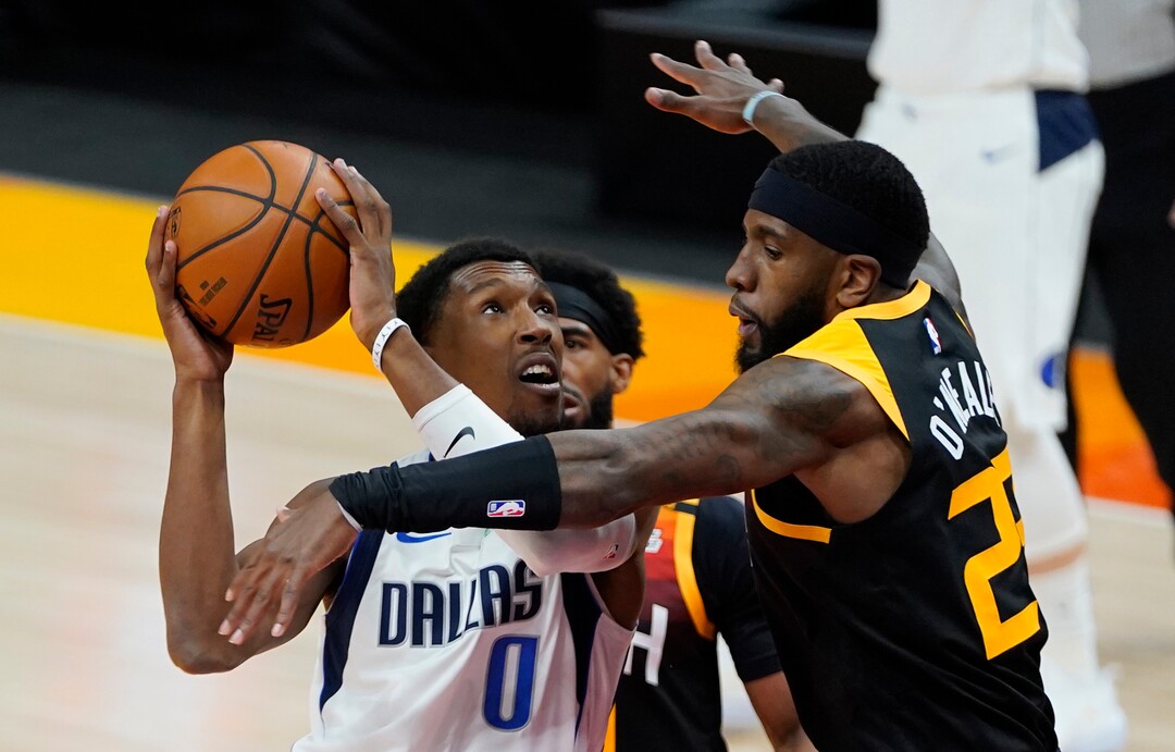 (Rick Egan | The Salt Lake Tribune)  Dallas Mavericks guard Josh Richardson (0) looks for a shot as Utah Jazz forward Royce O'Neale (23) defends, in NBA action between the Utah Jazz and the Dallas Mavericks at Vivint Arena, on Friday, Jan. 29, 2021.