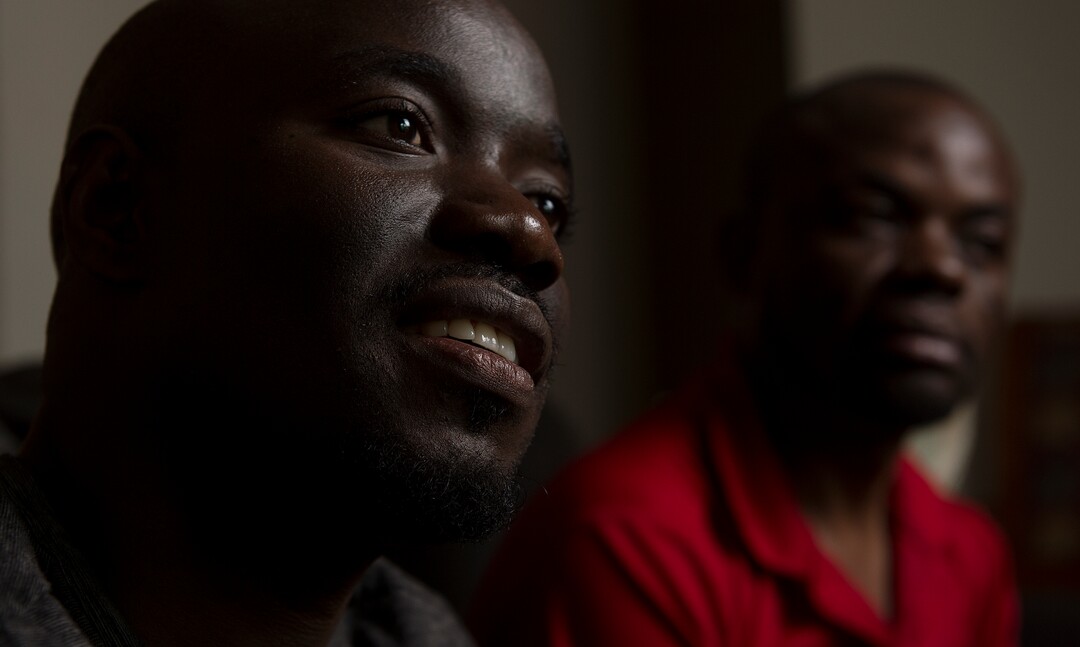 (Leah Hogsten  |  The Salt Lake Tribune) l-r In their native Uganda, a place where being gay can send you to prison, Barnabas Wobiliya and Apollo Kimuli risked their lives as advocates for AIDS education and equality for the LGBTQ community. Threatened with death, both men fled and spent a year in refugee camps before resettlement in Utah. The two are now trying to build their lives here, while using the Internet to continue their activism for others in Africa's LGBTQ community.