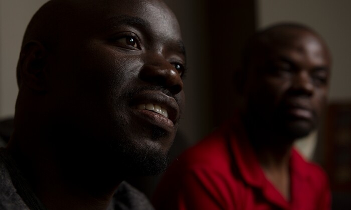 (Leah Hogsten | The Salt Lake Tribune) l-r In their native Uganda, a place where being gay can send you to prison, Barnabas Wobiliya and Apollo Kimuli risked their lives as advocates for AIDS education and equality for the LGBTQ community. Threatened with death, both men fled and spent a year in refugee camps before resettlement in Utah. The two are now trying to build their lives here, while using the Internet to continue their activism for others in Africa's LGBTQ community.