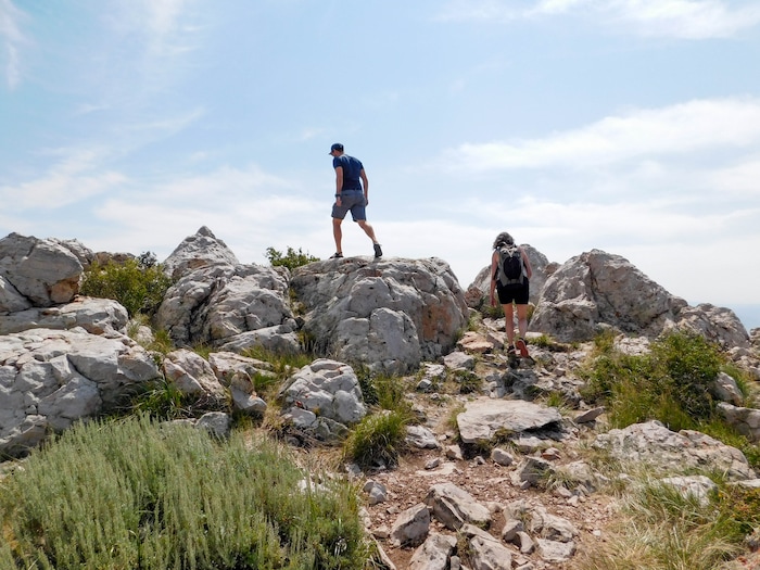 (Erin Alberty|The Salt Lake Tribune) Hikers climb rocks on top of Bald Mountain on Aug. 6, 2017 at Deer Creek Resort.