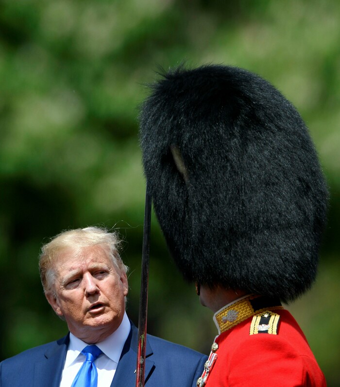 U.S. President Donald Trump inspects an honour guard during a welcome ceremony in the garden of Buckingham Palace, in London, for President Donald Trump and first lady Melania Trump Monday, June 3, 2019, on the first day of a three day state visit to Britain. (Toby Melville/Pool via AP)