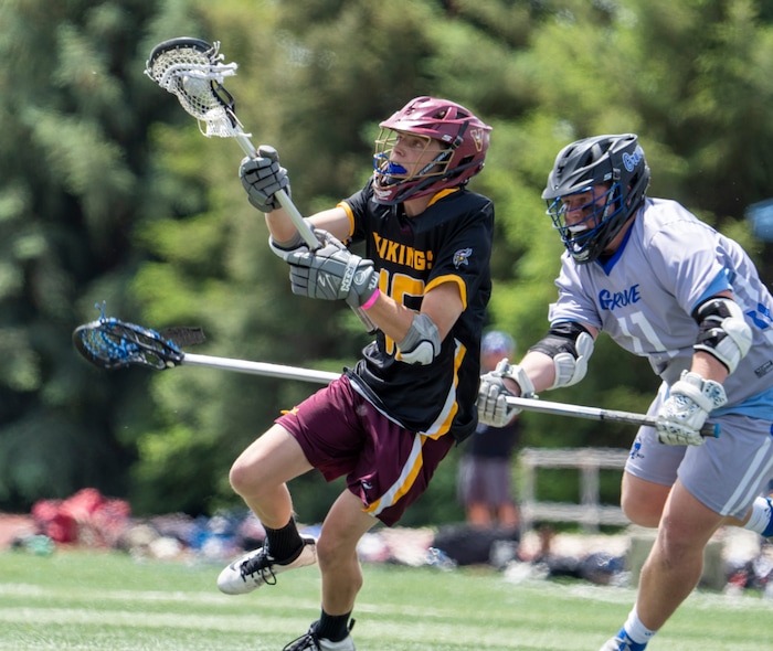 (Rick Egan | The Salt Lake Tribune) Tanner McCurdy runs for Viewmont, as Dane Doman defends for Pleasant Grove, in the Division C championship game between the Viewmont Vikings and the Pleasant Grove Vikings, in Layton, on Saturday, May 29, 2021.