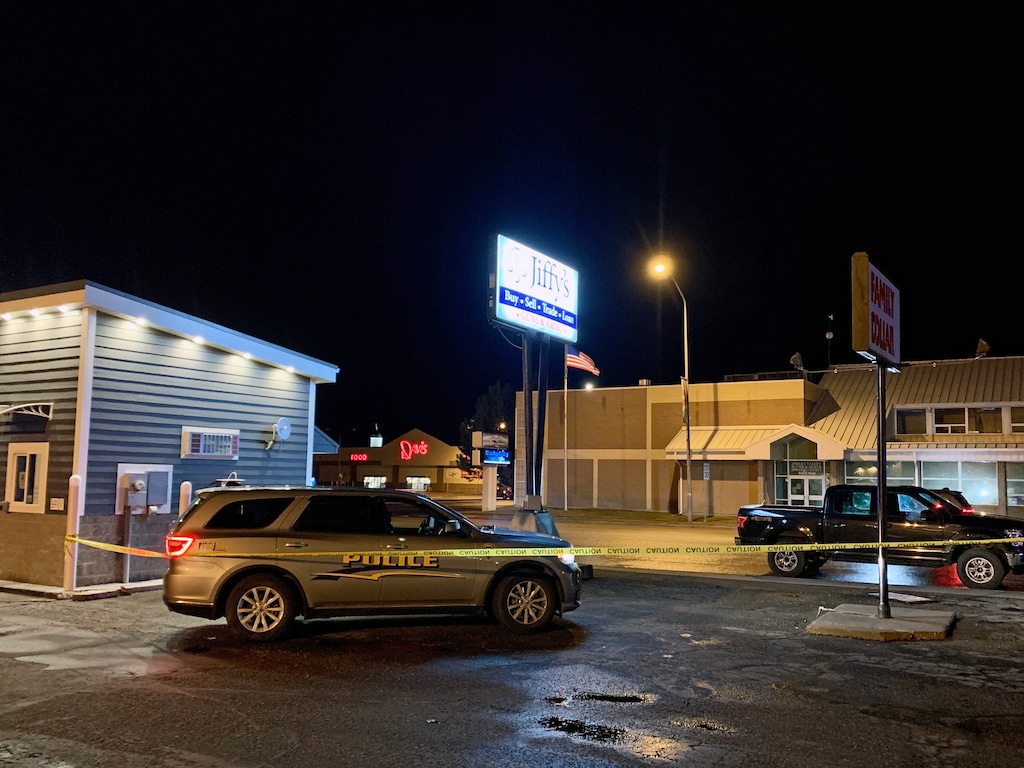 (Photo courtesy of the Uintah County Sheriff's Office) Crime scene tape surrounds a parking lot on Vernal's Main Street, where police shot at a man Thursday, March 19, 2020.