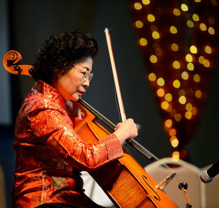 (Trent Nelson | The Salt Lake Tribune)  Ying Huang plays the cello with the Utah Chinese Folk Orchestra performs at the Chinese New Year Celebration at the County Library's Viridian Event Center in West Jordan, Saturday Feb. 17, 2018.