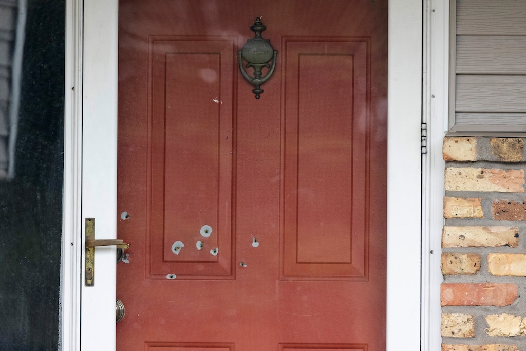 (Tim Gruber | The New York Times) Bullet holes in the door of State Sen. John Hoffman’s home in Chaplin, Minn., on Saturday, June 14, 2025.