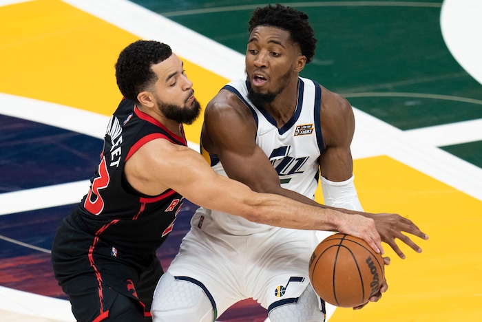 (Rick Egan | The Salt Lake Tribune) Toronto Raptors guard Fred VanVleet (23) is called for a foul as collides with Utah Jazz guard Donovan Mitchell (45), in NBA action between Utah Jazz and Toronto Raptors, at Vivint Arena, in Salt Lake City, on  Thursday, Nov. 18, 2021.