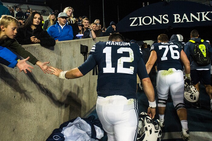 (Chris Detrick  |  The Salt Lake Tribune)  Brigham Young Cougars quarterback Tanner Mangum (12) walks off of the field after the game LaVell Edwards Stadium Friday, October 6, 2017. Boise State Broncos defeated Brigham Young Cougars 24-7.
