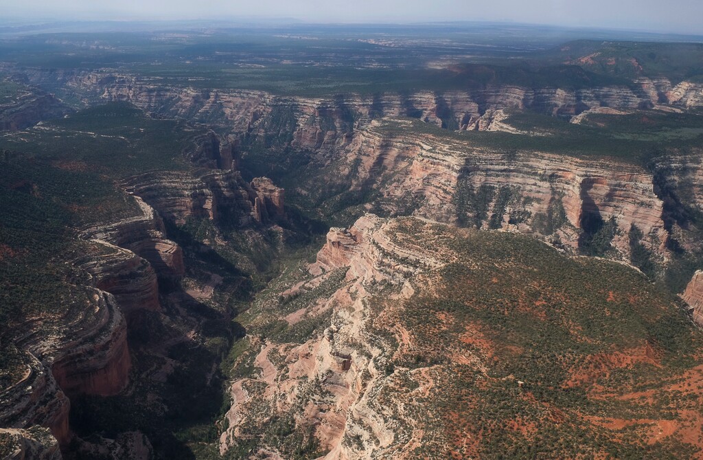 FILE - This May 8, 2017, file photo shows an aerial view of Arch Canyon within Bears Ears National Monument in Utah. President Donald Trump is shrinking two national monuments in Utah, Bears Ears and Grand Staircase Escalante, accepting the recommendation of Interior Secretary Ryan Zinke to reverse protections established by two Democratic presidents, a Sen. Orrin Hatch, R-Utah, said Friday, Oct. 27.  (Francisco Kjolseth/The Salt Lake Tribune via AP, File)