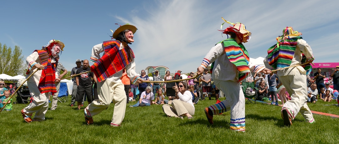 (Leah Hogsten  |  The Salt Lake Tribune) Tuttilli Ballet Folklorico dancers perform a traditional Michoacan, Mexico dance as an elder in the "Dance of Viejitos" at the Cinco de Mayo Celebration, Saturday, May 5, 2018 at Centennial Park in West Valley City.