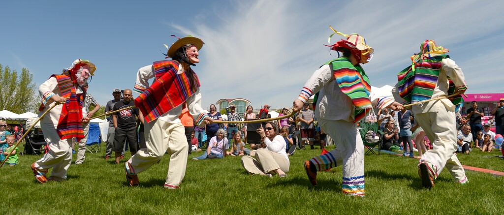 (Leah Hogsten | The Salt Lake Tribune) Tuttilli Ballet Folklorico dancers perform a traditional Michoacan, Mexico dance as an elder in the "Dance of Viejitos" at the Cinco de Mayo Celebration, Saturday, May 5, 2018 at Centennial Park in West Valley City.