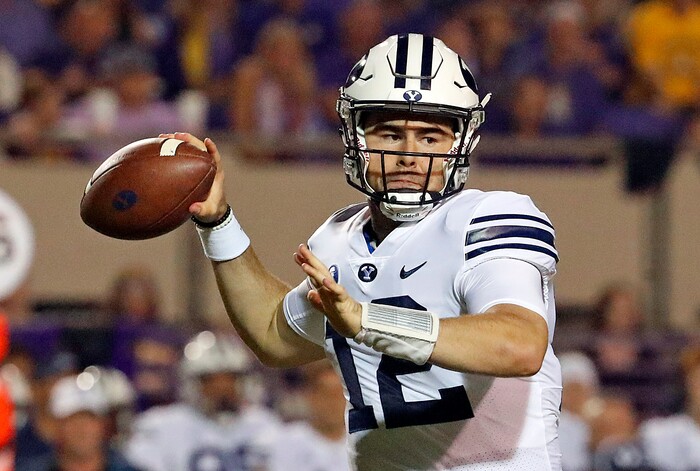 BYU's Tanner Mangum (12) readies to deliver a pass during the first half of an NCAA college football game against East Carolina in Greenville, N.C., Saturday, Oct. 21, 2017. (AP Photo/Karl B DeBlaker)